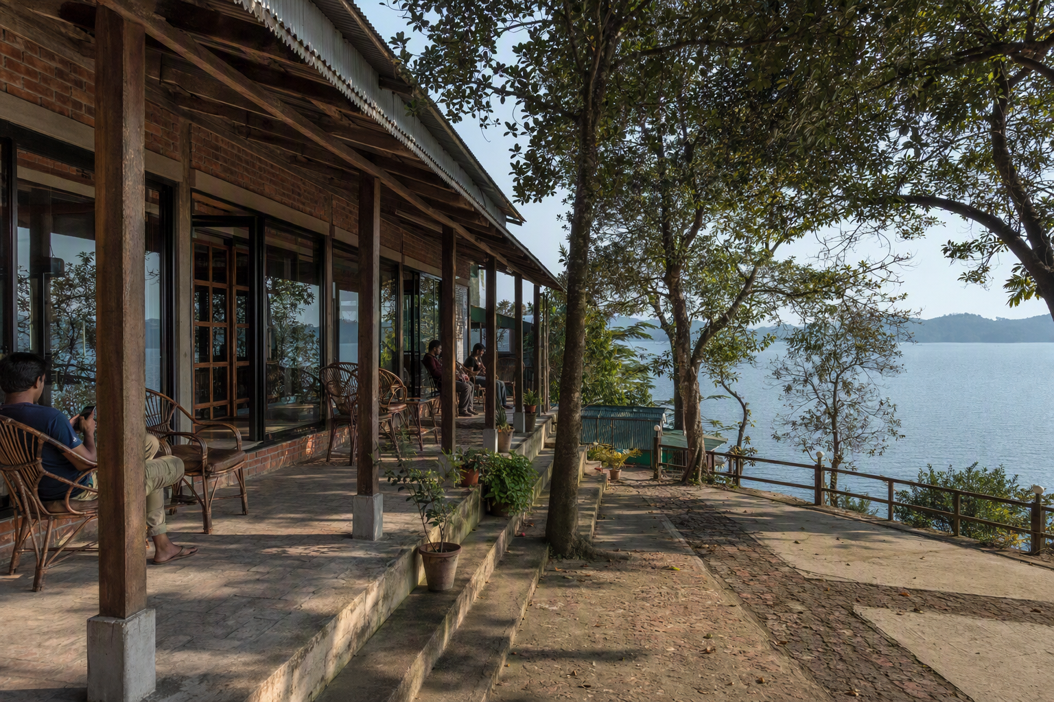 A modest Rangamati lakeside stay among trees with Kaptai Lake beyond