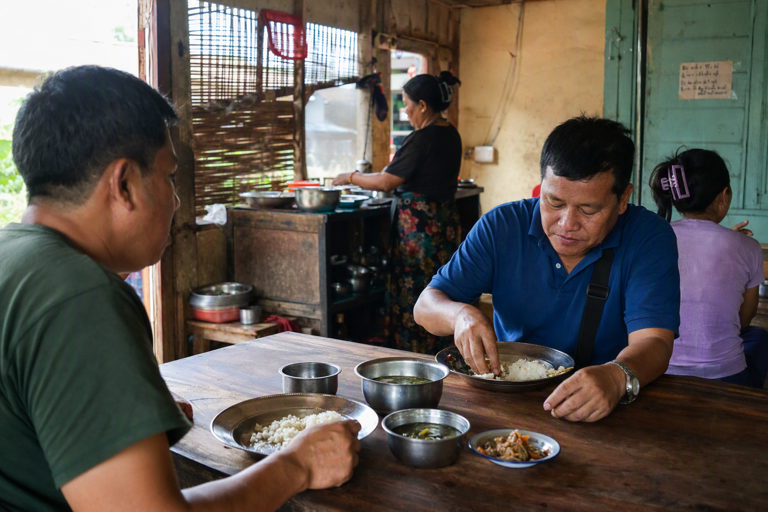 Rice and seasonal preparations served in a small Hill Tracts town restaurant
