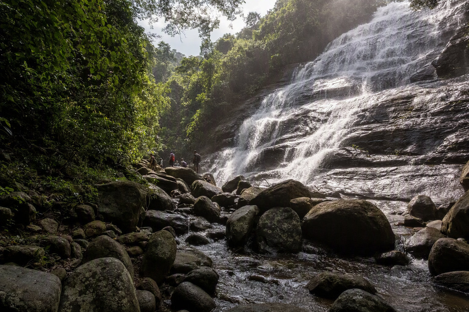 Nafakhum Waterfall surging through a rocky green gorge on the upper Sangu system